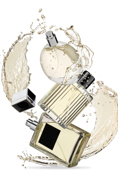 Bottles,Of,Perfumes,And,Splashes,On,White,Background